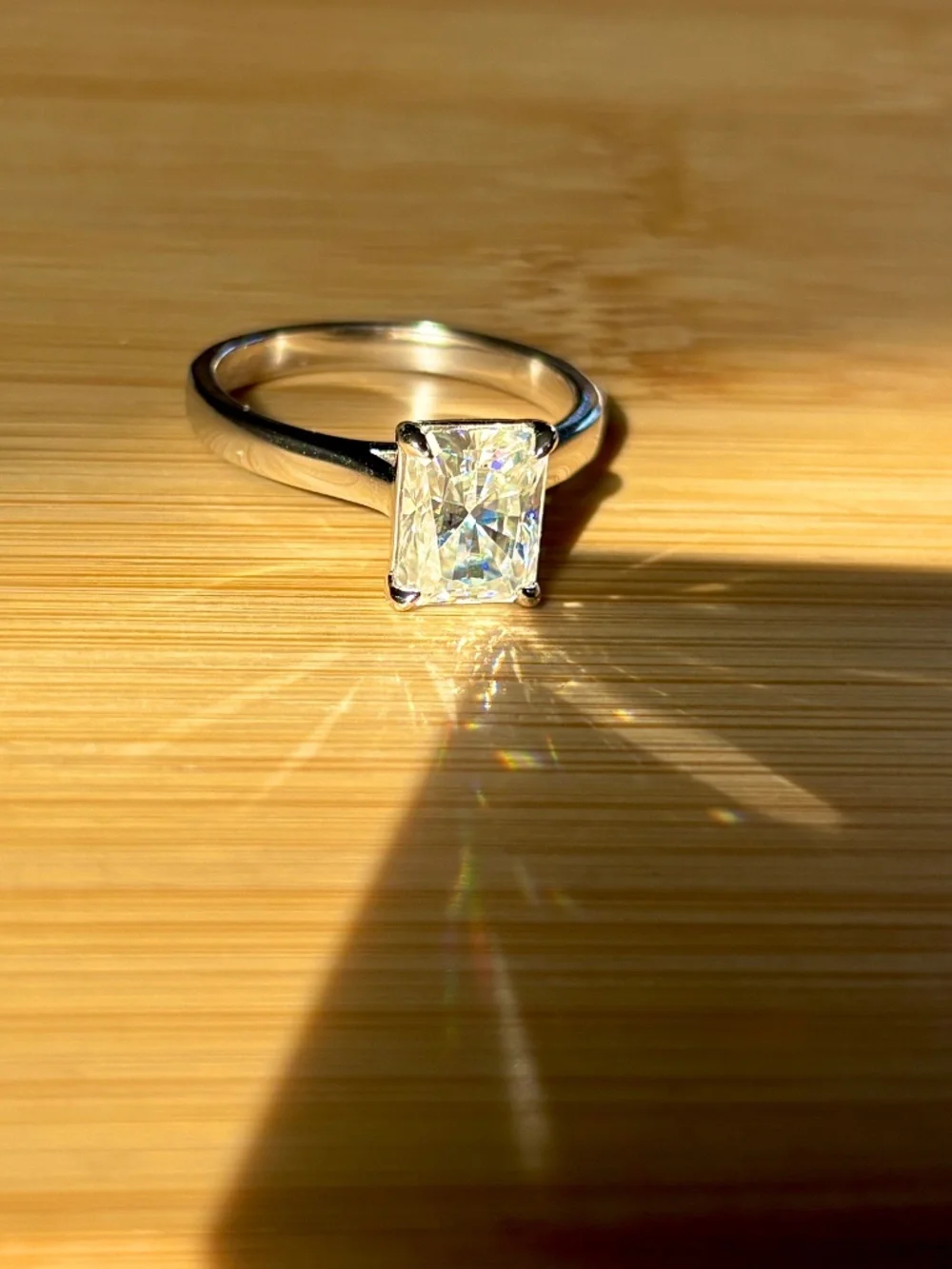 A certified 3ct radiant Moissanite solitaire in solid sterling silver and 18k!